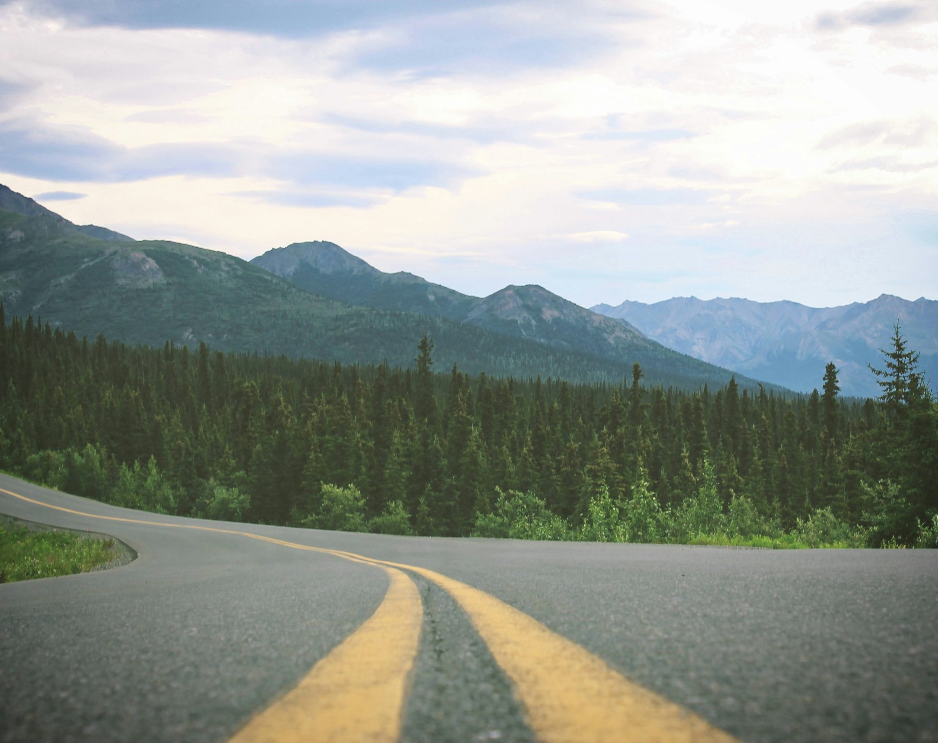 Alaska highway with mountains